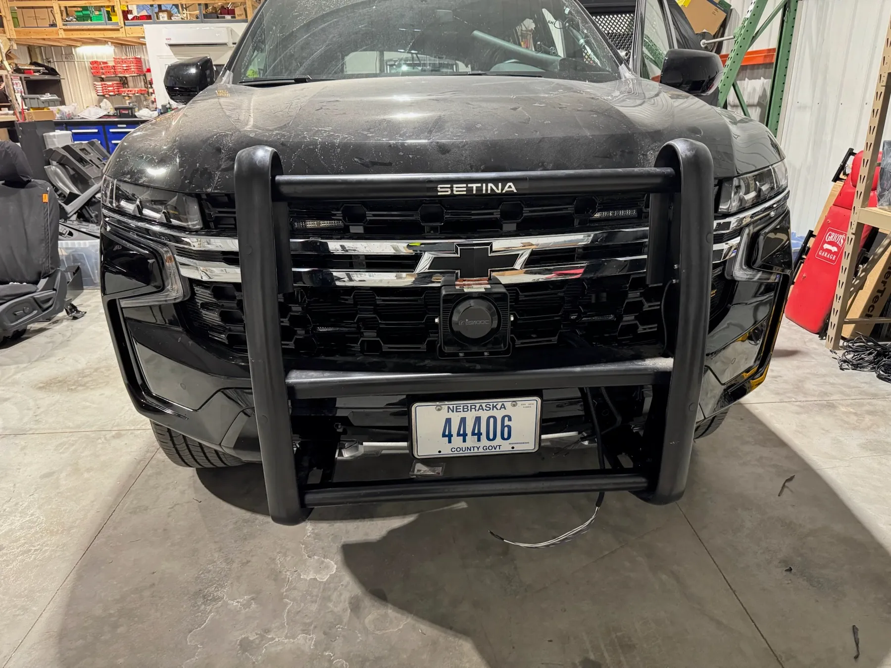 Black Chevrolet police truck with Setina push bumper and warning lights by Elite Vehicle Outfitters