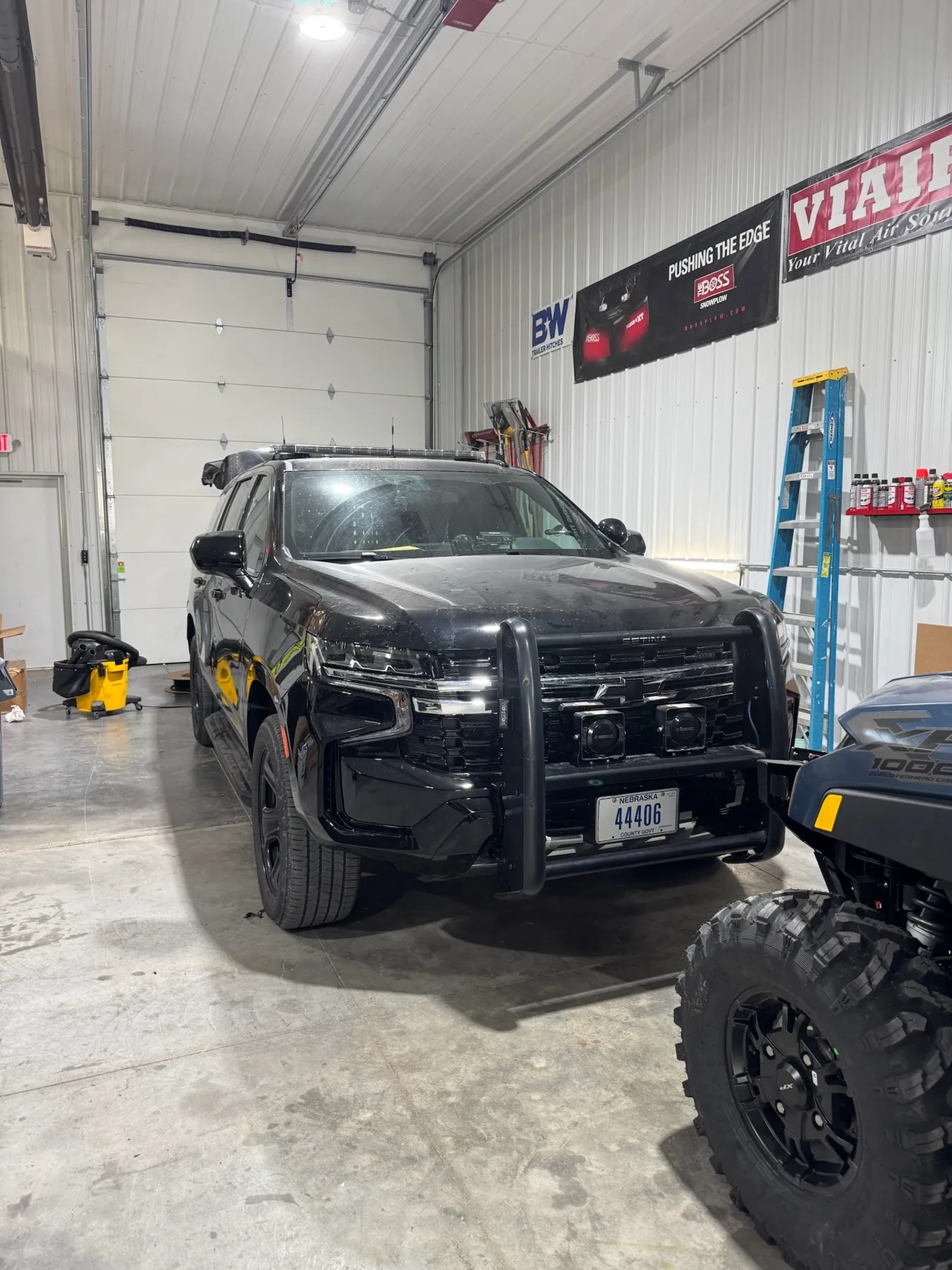 Blacked-out Chevrolet Tahoe police pursuit vehicle with push bumper by Elite Vehicle Outfitters