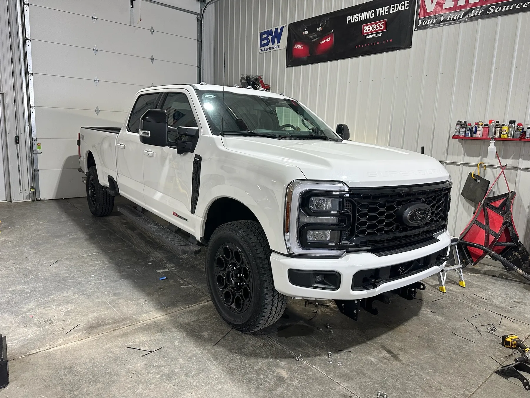 White Ford F-350 commercial work truck build at Elite Vehicle Outfitters